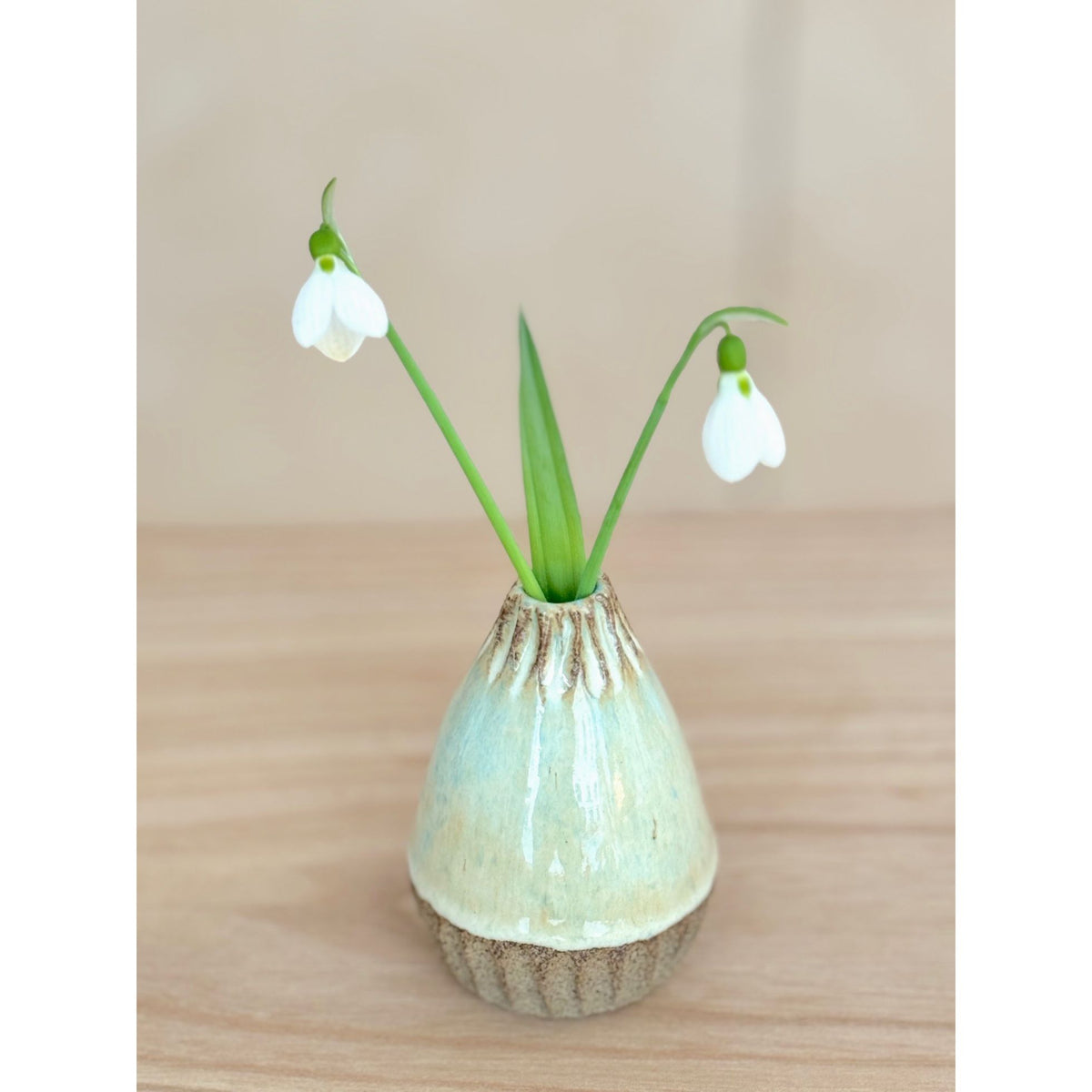 Small carved ceramic vase